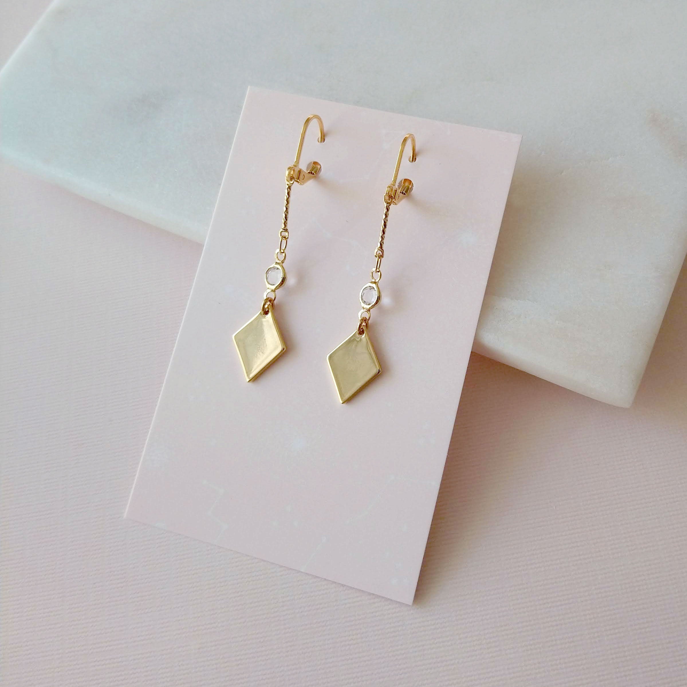 Gold and crystal earrings diamond shape