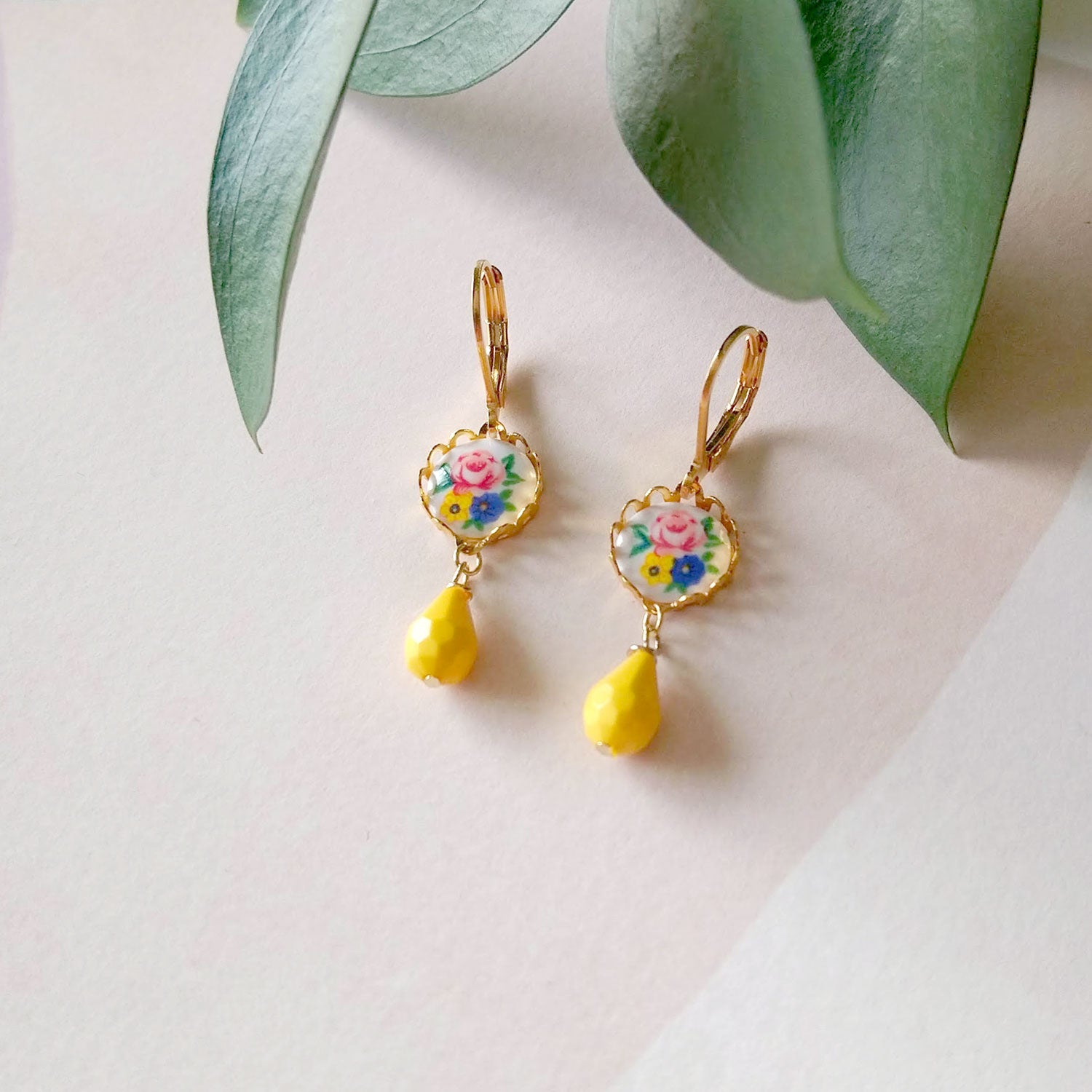 yellow earrings with vintage flower cabochons