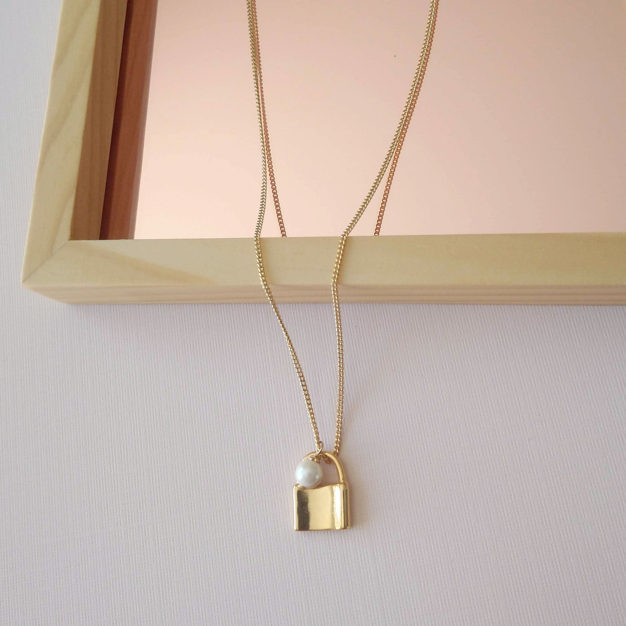 gold padlock necklace with pearl